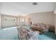 Inviting living room with vaulted ceiling, plush sofas, and a glass-topped coffee table at 13000 Club Dr, Hudson, FL 34667