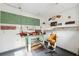Interior view of the workshop space featuring ample lighting and storage at 13000 Club Dr, Hudson, FL 34667