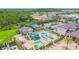 Aerial view of a waterpark and pool within a community, offering a glimpse of its recreational amenities at 30715 Tumbleberry St, Wesley Chapel, FL 33543