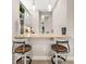 Bar area with pendant lighting, stylish bar stools, and open view to another room at 30715 Tumbleberry St, Wesley Chapel, FL 33543