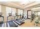 Community gym equipped with treadmills, exercise bikes, and weights for a convenient workout at 30715 Tumbleberry St, Wesley Chapel, FL 33543