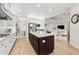 Bright, spacious kitchen with a large island, stainless appliances, and open layout at 30715 Tumbleberry St, Wesley Chapel, FL 33543