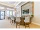 Stylish lounge area with a bar and high-top seating, creating a perfect space for socializing at 30715 Tumbleberry St, Wesley Chapel, FL 33543