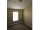 Bedroom featuring neutral paint and carpet, with a light filtering window at 6769 Breezy Palm Dr, Riverview, FL 33578