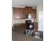 Updated kitchen with granite countertops, wood cabinetry, and stainless steel microwave at 6769 Breezy Palm Dr, Riverview, FL 33578