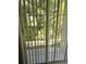 View of patio through sliding glass doors at 6769 Breezy Palm Dr, Riverview, FL 33578