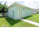 Private backyard with lush grass, walkway, and fenced-in area offers serene outdoor living at 11125 Winthrop Lake Dr, Riverview, FL 33578