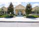 Community clubhouse with a welcoming entrance and manicured landscaping at 11125 Winthrop Lake Dr, Riverview, FL 33578