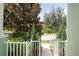 Inviting entrance with lush landscaping and a charming white picket fence at 11125 Winthrop Lake Dr, Riverview, FL 33578