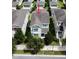 Two-story home with a balcony, white picket fence, and landscaped front yard at 11125 Winthrop Lake Dr, Riverview, FL 33578
