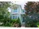 Charming two-story home with a balcony and lush landscaping at 11125 Winthrop Lake Dr, Riverview, FL 33578