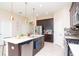 Spacious kitchen featuring a center island, stainless steel appliances, and modern finishes at 11125 Winthrop Lake Dr, Riverview, FL 33578
