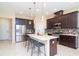 Well-equipped kitchen with a center island, stainless steel appliances, and ample cabinet space at 11125 Winthrop Lake Dr, Riverview, FL 33578