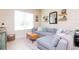 Well-lit living room showcases a spacious sectional, sleek mirror, and floating shelves at 11125 Winthrop Lake Dr, Riverview, FL 33578