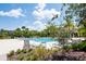 Resort-style community pool with lounge chairs and lush landscaping at 11125 Winthrop Lake Dr, Riverview, FL 33578