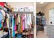 Spacious walk-in closet featuring ample shelving, hanging rods, and storage options for organized living at 11125 Winthrop Lake Dr, Riverview, FL 33578