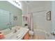 Clean and functional bathroom with a single vanity and a shower-tub combination at 12127 Luftburrow Ln, Hudson, FL 34669