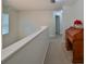 Hallway with neutral carpet, an office nook, and view of an interior door at 12127 Luftburrow Ln, Hudson, FL 34669