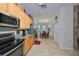 Bright eat-in kitchen featuring stainless steel appliances and light wood cabinetry at 12127 Luftburrow Ln, Hudson, FL 34669