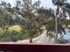Balcony overlooking a scenic view of lush greenery, mature trees, and a golf course at 2333 Feather Sound Dr # B301, Clearwater, FL 33762