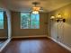 Bedroom with a ceiling fan, hardwood floors, and window view, creating a serene and comfortable space at 2333 Feather Sound Dr # B301, Clearwater, FL 33762