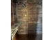 Walk-in closet with wooden walls and metal shelving for organized storage at 2333 Feather Sound Dr # B301, Clearwater, FL 33762