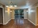 An open living room with sliding glass doors leading to a balcony, filling the space with natural light at 2333 Feather Sound Dr # B301, Clearwater, FL 33762