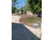 Backyard area featuring a concrete patio and fenced-in area with some trees and grass at 4228 Spring Way Cir, Valrico, FL 33596