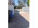 Paved backyard area with white fence surrounding the open area at 4228 Spring Way Cir, Valrico, FL 33596