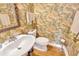 Quaint powder room featuring tropical print wallpaper, wood flooring, and pedestal sink at 4845 W Sunset Blvd, Tampa, FL 33629