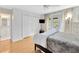 Comfortable bedroom with a ceiling fan, a closet and doors that leads to the exterior at 4845 W Sunset Blvd, Tampa, FL 33629