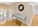 Hallway with a desk, stairs, a light fixture, and neutral color walls at 4845 W Sunset Blvd, Tampa, FL 33629