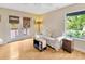 Bright living room featuring wood floors, natural light, and French doors to balcony with a cozy atmosphere at 4845 W Sunset Blvd, Tampa, FL 33629