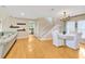 Open concept living area with hardwood floors, dining space, and seamless flow into the kitchen at 4845 W Sunset Blvd, Tampa, FL 33629