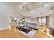 Spacious living room with soaring ceilings, hardwood floors, and an open concept layout to the dining area at 4845 W Sunset Blvd, Tampa, FL 33629