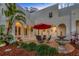 Inviting outdoor patio with charming water feature, perfect for relaxation and entertaining at 4845 W Sunset Blvd, Tampa, FL 33629