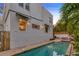 Backyard pool with brick pavers, showing home exterior, perfect for outdoor relaxation and entertaining at 4845 W Sunset Blvd, Tampa, FL 33629