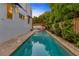 Inviting pool surrounded by lush greenery, offering a private outdoor oasis at 4845 W Sunset Blvd, Tampa, FL 33629