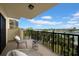 Relax on this private balcony with tranquil water views and comfortable seating, creating an ideal retreat at 7537 Bayshore Dr # 406, Treasure Island, FL 33706