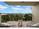 Enjoy serene water views from this inviting balcony, complete with comfortable seating for ultimate relaxation at 7537 Bayshore Dr # 406, Treasure Island, FL 33706