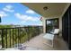 Balcony perfect for relaxing, offering breathtaking views of the surroundings and comfortable seating options at 7537 Bayshore Dr # 406, Treasure Island, FL 33706
