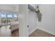 Bedroom with a sliding glass door to a private balcony, an organized closet, and light wood floors at 7537 Bayshore Dr # 406, Treasure Island, FL 33706
