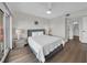 Bright bedroom with en suite bathroom features wood floors and neutral decor at 7537 Bayshore Dr # 406, Treasure Island, FL 33706