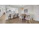Bright dining area offers seating for four, as well as a view of the modern, updated kitchen at 7537 Bayshore Dr # 406, Treasure Island, FL 33706