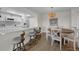 Bright dining area offers seating for four, as well as a view of the modern, updated kitchen at 7537 Bayshore Dr # 406, Treasure Island, FL 33706