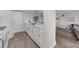 Modern kitchen area with view to living area offers updated appliances and plenty of countertop space at 7537 Bayshore Dr # 406, Treasure Island, FL 33706