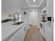 Well-lit kitchen area with stainless appliances, a large island, and an open view to living room at 7537 Bayshore Dr # 406, Treasure Island, FL 33706