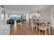 Open-concept living space with natural light, leading to a modern kitchen and cozy dining area at 7537 Bayshore Dr # 406, Treasure Island, FL 33706
