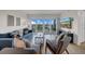 Relaxing living room features comfortable seating, a TV, and a balcony with scenic views at 7537 Bayshore Dr # 406, Treasure Island, FL 33706