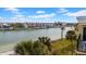 Beautiful view showcasing the waterfront property with lush greenery, creating an inviting oasis at 7537 Bayshore Dr # 406, Treasure Island, FL 33706